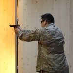 424TH Air Base Squadron on range indoor-M9 pistol and M4 rifle (6357458).jpg